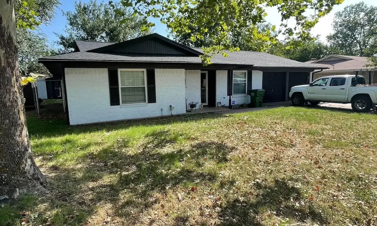 Professional roofing crew working on a residential roof in Portland